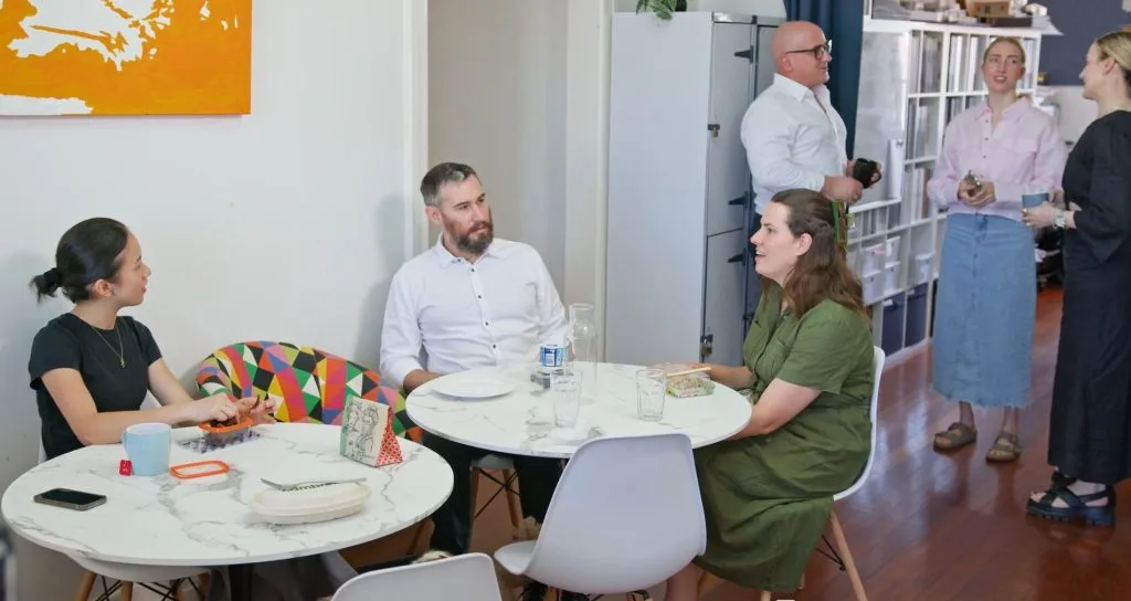 Coworkers chatting in the Salt Space lounge